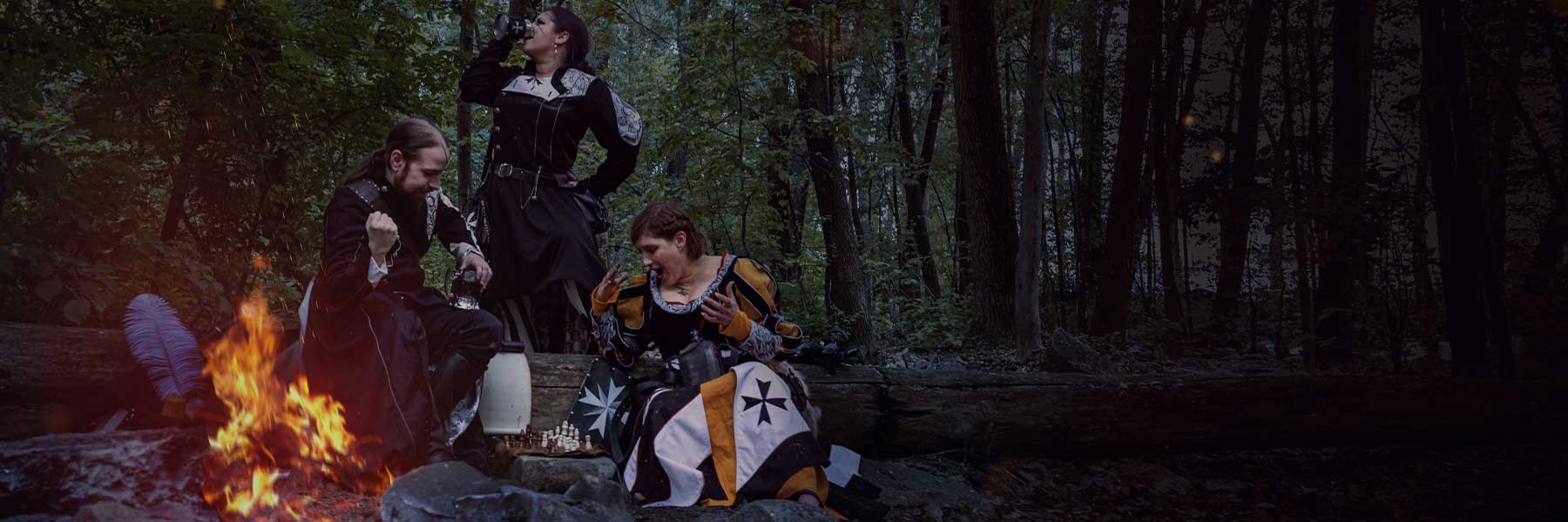 3 characters in Larp near of firecamp playing at chess and showing your guild heraldy for our custom service 