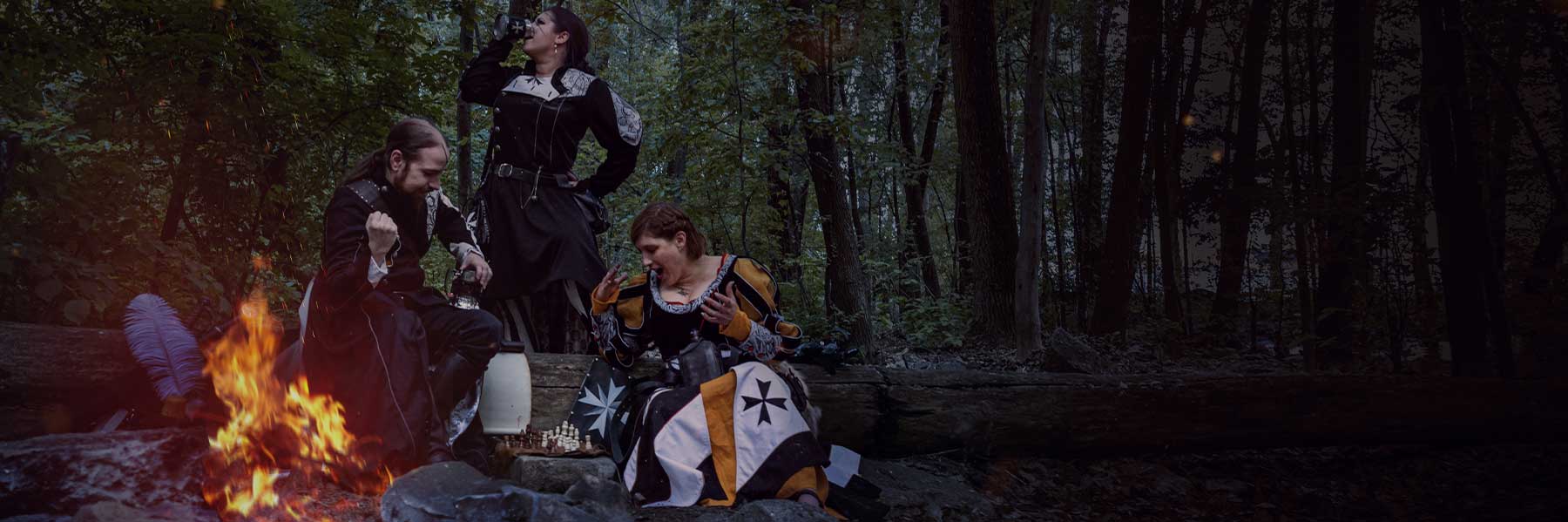 3 characters in Larp near of firecamp playing at chess and showing your guild heraldy for our custom service