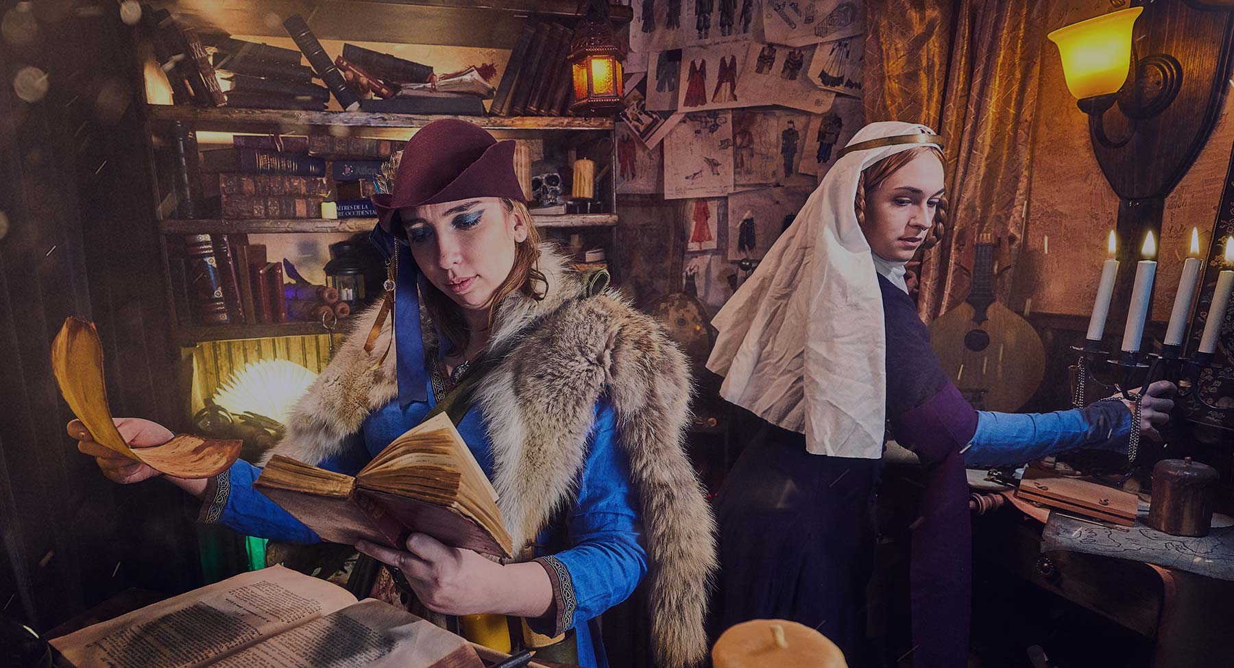 two feminine medieval character with dress in a fantasy library with spellbooks and reenactment historical costume larp