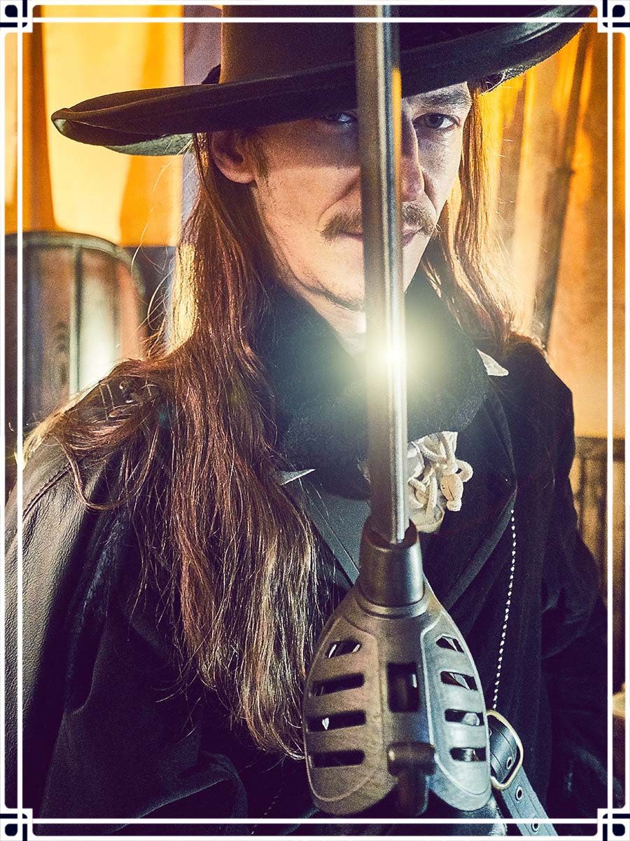 Profile picture of Stephane our accountant with the Agrippa Calimacil sword and a renaissance costume