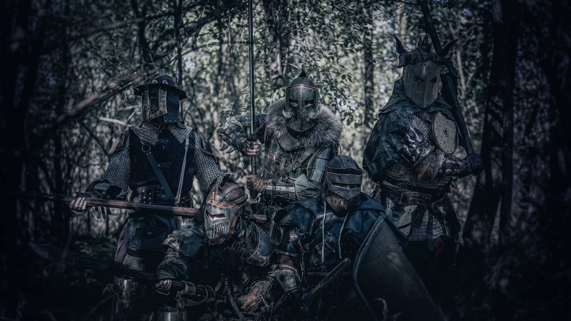 banner with 5 warriors with custom larp armor in leather and metal with a epic pose