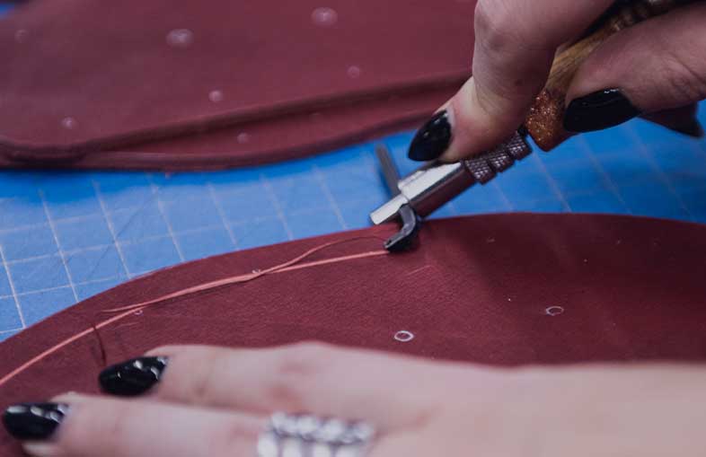 leatherworking on a leather custom larp armor to explain our steps of creations