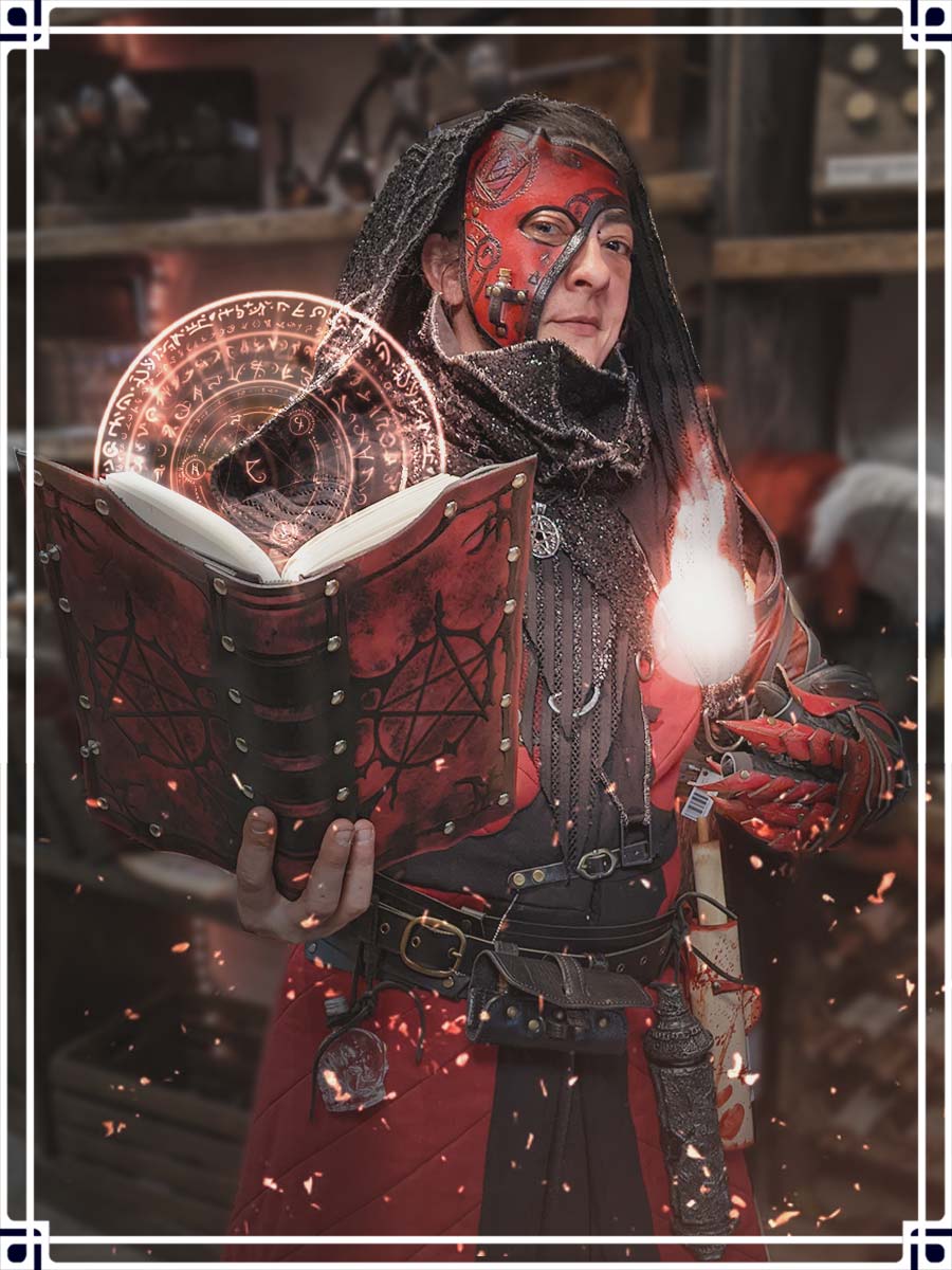 Profile Picture of Peg in a Red Custom LARP Costume with a leather mask and a magical spellbook